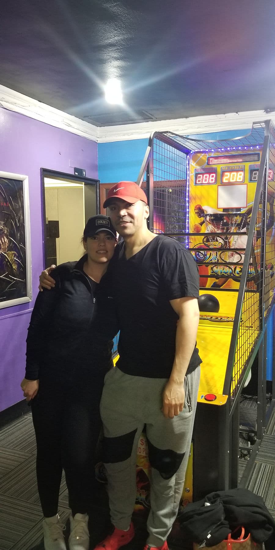 Two high score holders beside the Basketball arcade machine