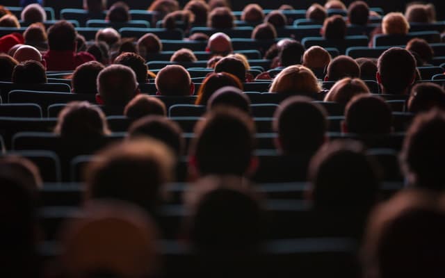 Audience enjoying a movie at Kent Theater